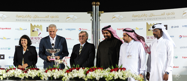 Peter Pond and his wife Jenny presenting the Jay Stream Cup to the winning connections from Umm Qarn Farm